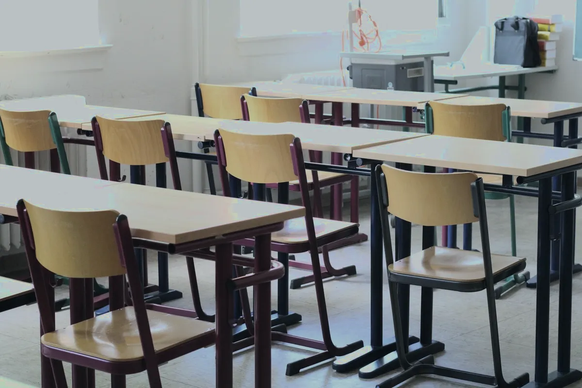 Empty classroom with desks and chairs